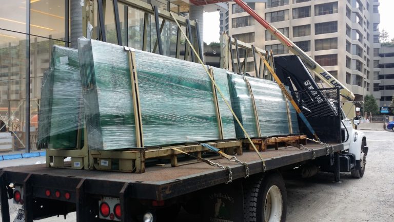 A number of glass panels on a flat bed truck