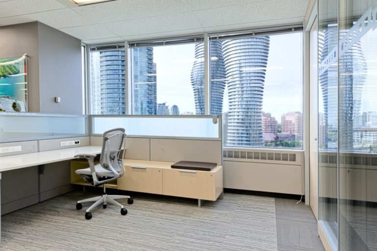 An office with large windows looking out over downtown Mississauga