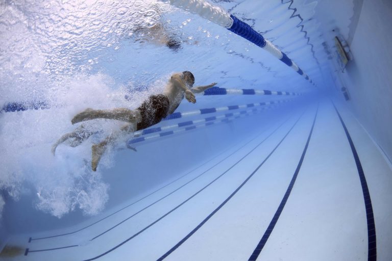 A underwater photograph of a person swimming laps